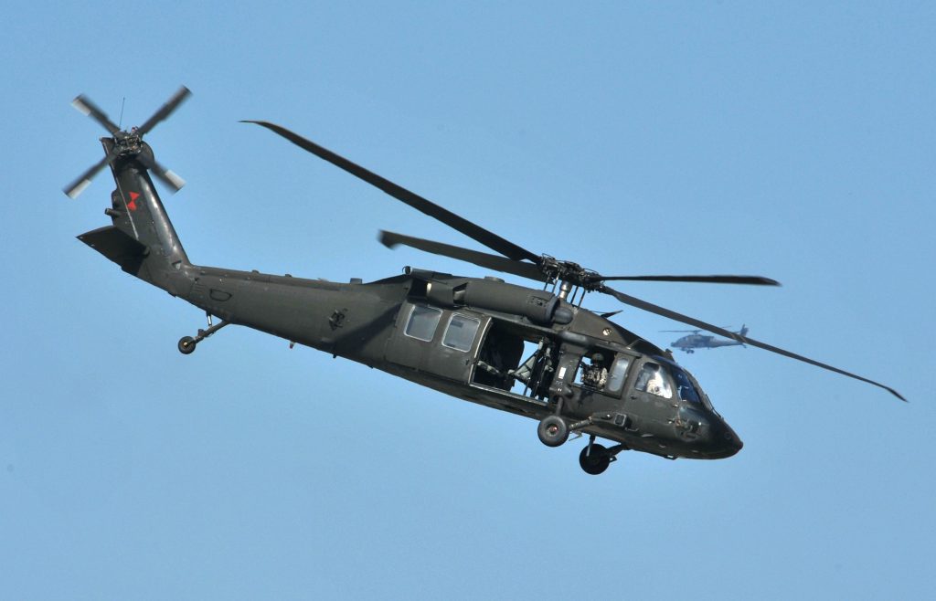 A U.S. Army UH-60 Black Hawk helicopter assigned to the 159th Combat Aviation Brigade, 101st Airborne Division, flies off after unloading Soldiers at a drop point during air assault demonstration training at Campbell Army Airfield aboard Fort Campbell, Ky., Aug. 7, 2012. Soldiers were preparing a demonstration for the upcoming Week of the Eagles Air Show. (U.S. Army photo by Sam Shore/Released)